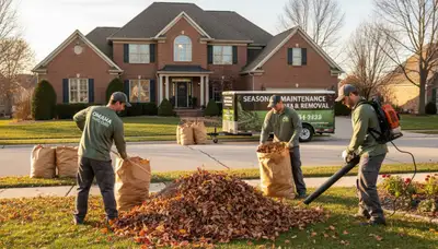 Technicians raking and bagging fall leaves during yard clean up in Omaha, NE by Chop Chop Landscaping