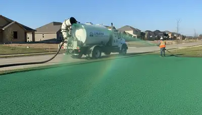 Hydroseeder truck spraying green slurry for lawn hydroseeding in Omaha, NE by Chop Chop Landscaping